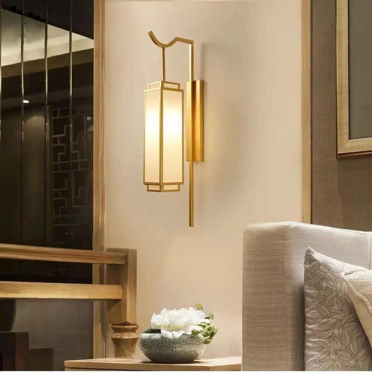 Luxeva chinoiserie lantern wall sconce, brushed gold, living room lifestyle