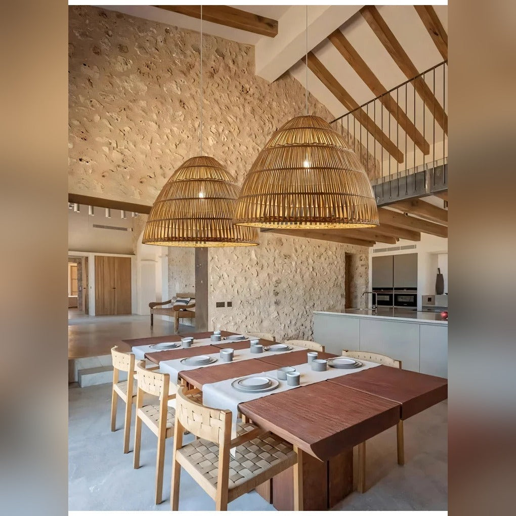 Htaeloria woven bamboo pendant lights over dining table, stone wall interior