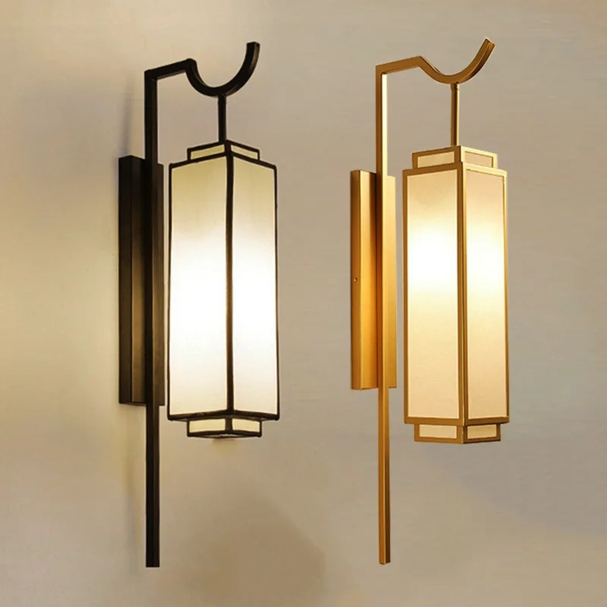 Luxeva lantern wall sconce shown in matte black and brushed gold finishes