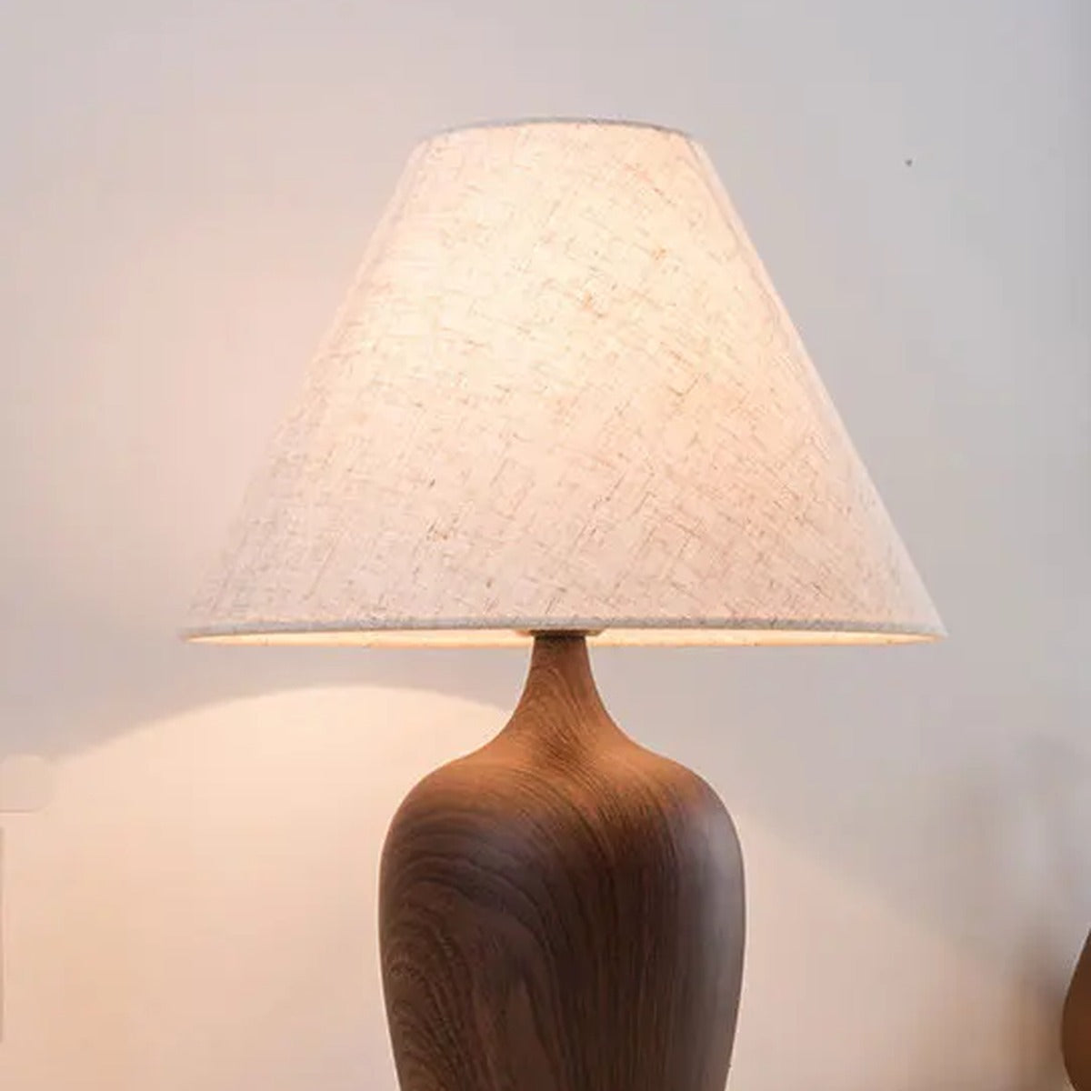 Wood-Effect Vase Base Table Lamp – Pausen – Natural Linen Shade, Lit