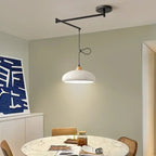 Swing-Arm Pendant Light – Galrex – Style B shade in black, lifestyle view