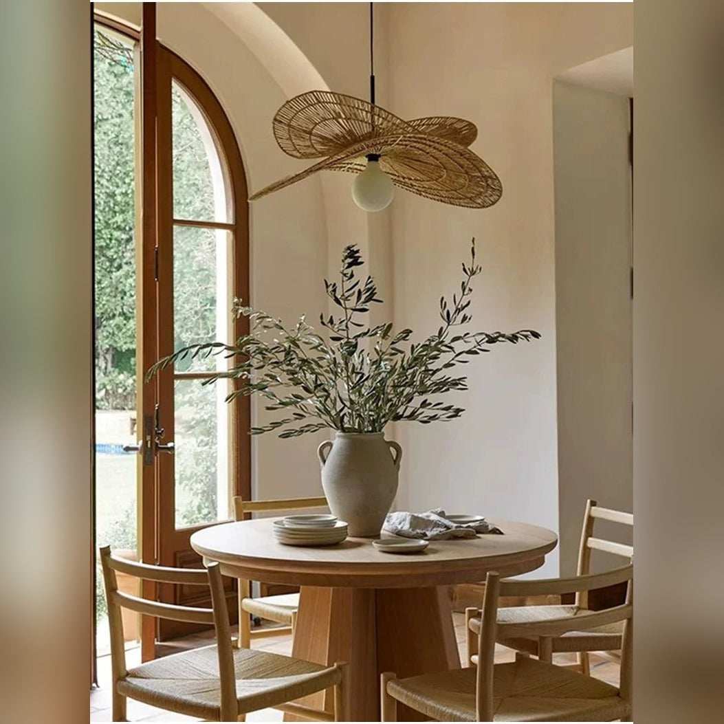 Handwoven Rattan Wing Pendant Light Mtavion – Lifestyle in arched dining room