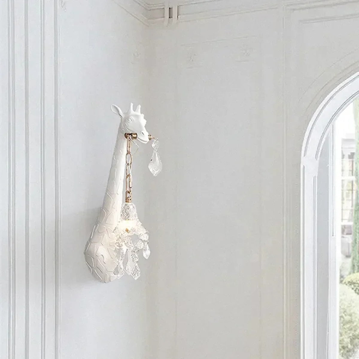 Serengeti giraffe wall sconce, white finish, lit in a hallway — lifestyle