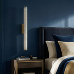 Enox marble wall sconce, brass finish, bedside lifestyle