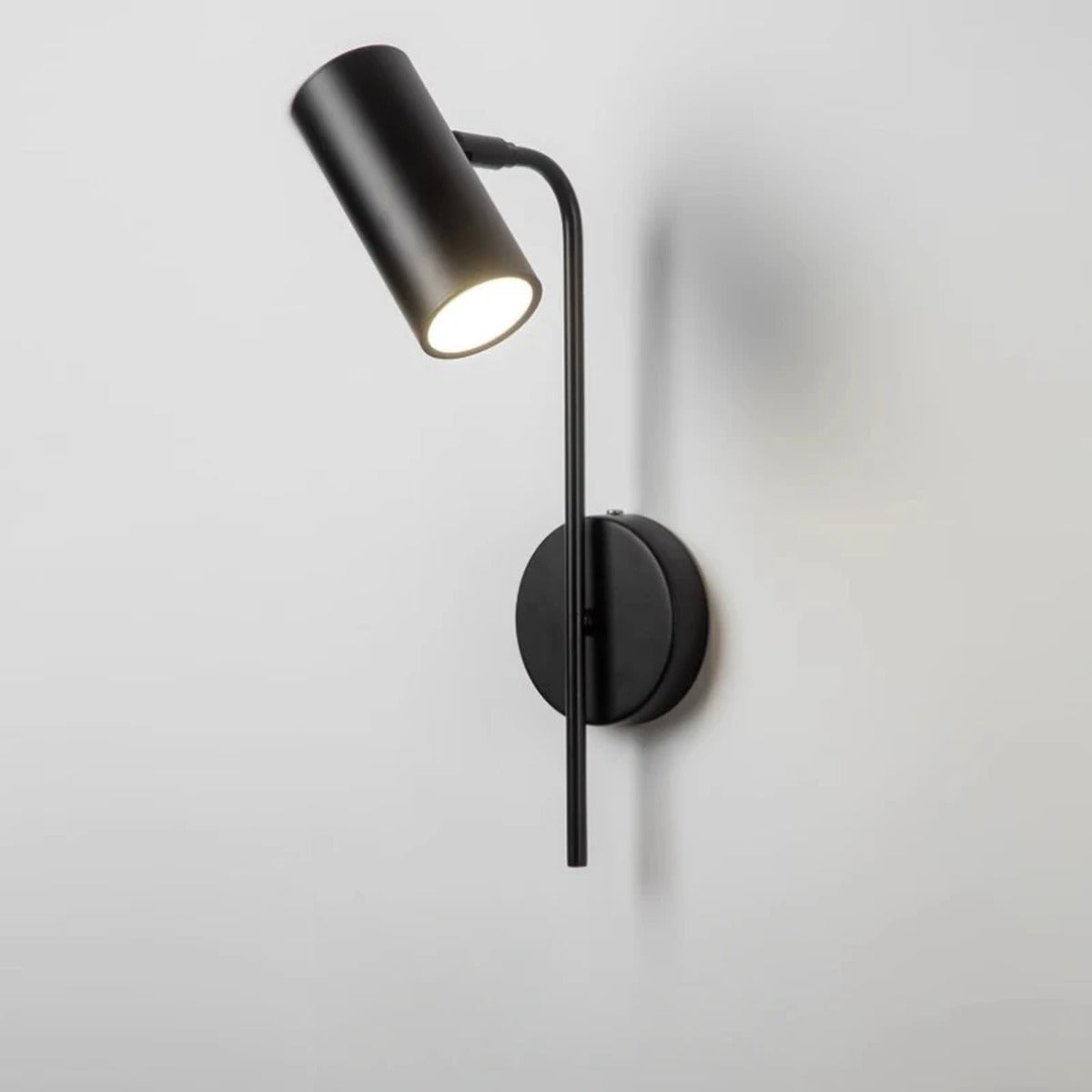 Slim Cylindrical Pivoting Spot Wall Sconce – Torvaex – Lifestyle View 2