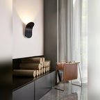 Cletya Arlexon curved aluminum wall sconce with hidden light source creating soft wall wash