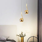Wevonthal pendant light — polished gold, twin installation above bed console