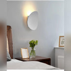 Galleron Disc wall sconce in white, lifestyle bedroom setting