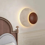 Sculptural Eclipse Wall Sconce Umbrion — lifestyle bedroom view
