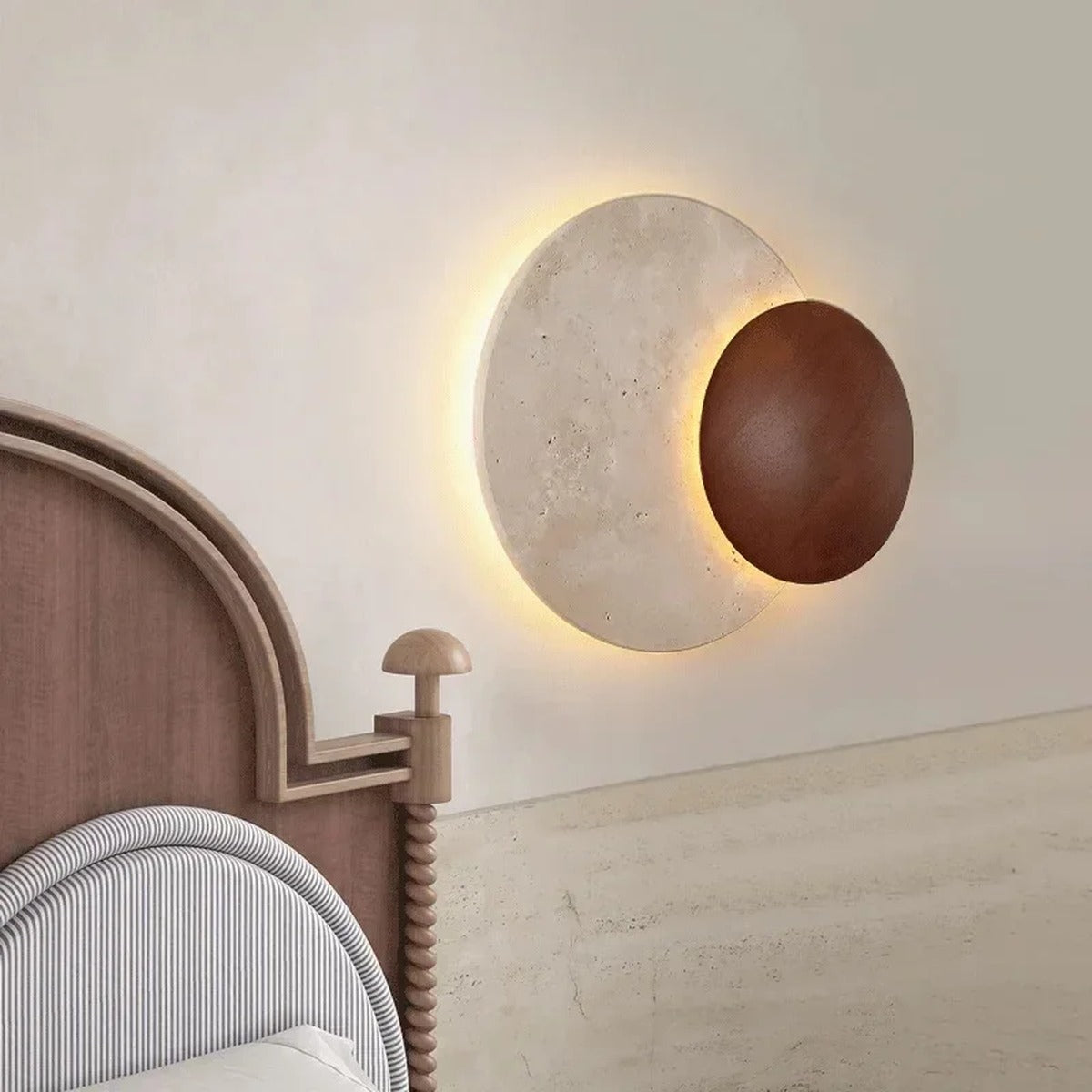 Sculptural Eclipse Wall Sconce Umbrion — lifestyle bedroom view