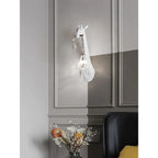 Serengeti giraffe wall sconce, white finish, styled interior wall — lifestyle