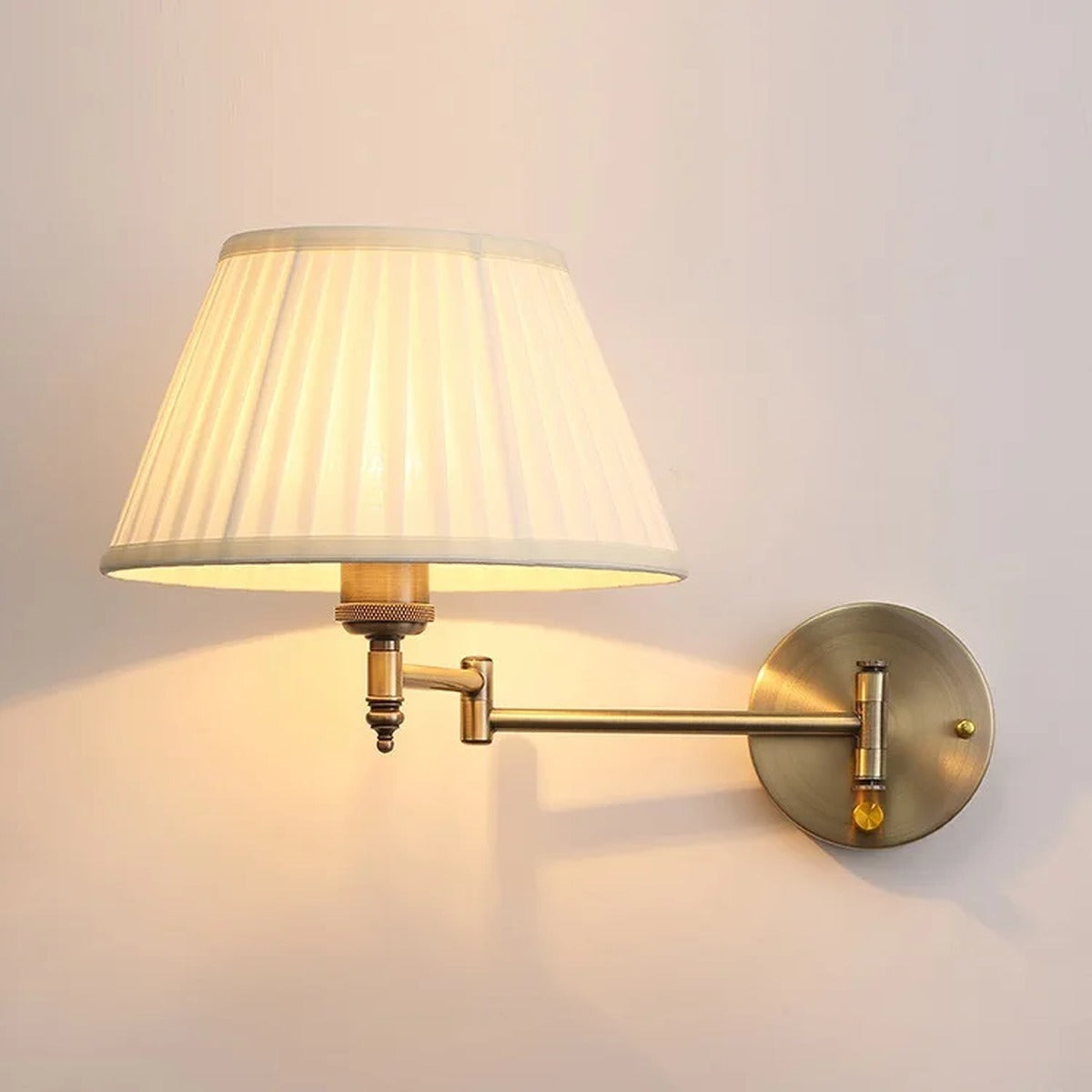 Brass Swing-Arm Pleated Shade Wall Sconce – Thelorn – Illuminated wall mount