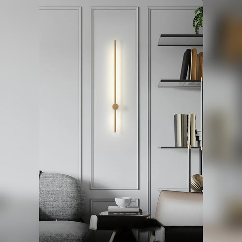 Adjustable Linear Aluminum Wall Sconce Luxara — living room lifestyle, brass finish