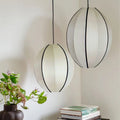 Cletya Zorvelia sculptural silk oval pendant light in cream suspended against neutral background