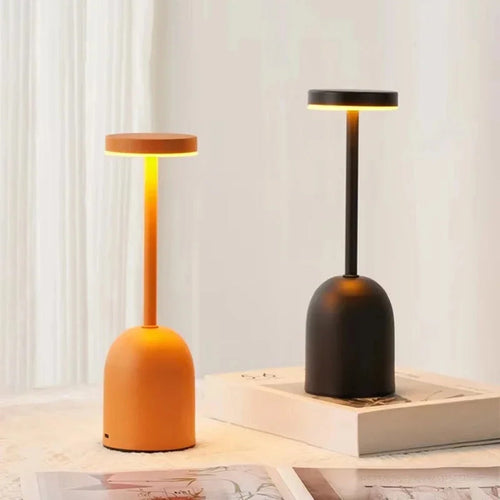 Threshon cordless LED table lamp — Terracotta Orange and Matte Black side by side, warm light glowing