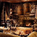 Suaelindra wood barrel pendant lights in a cabin lounge by the fireplace