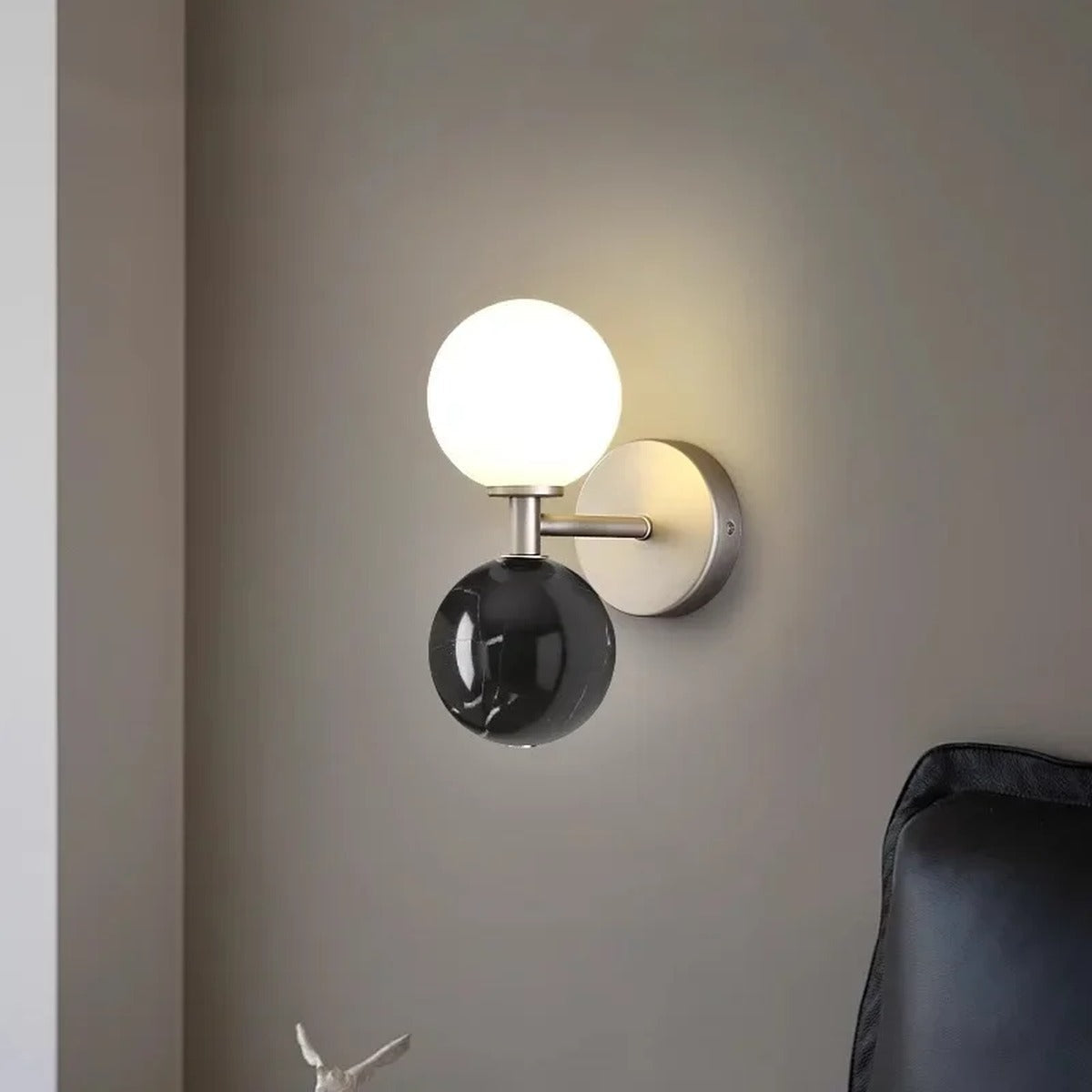 Genival — black marble version flanking bathroom mirror