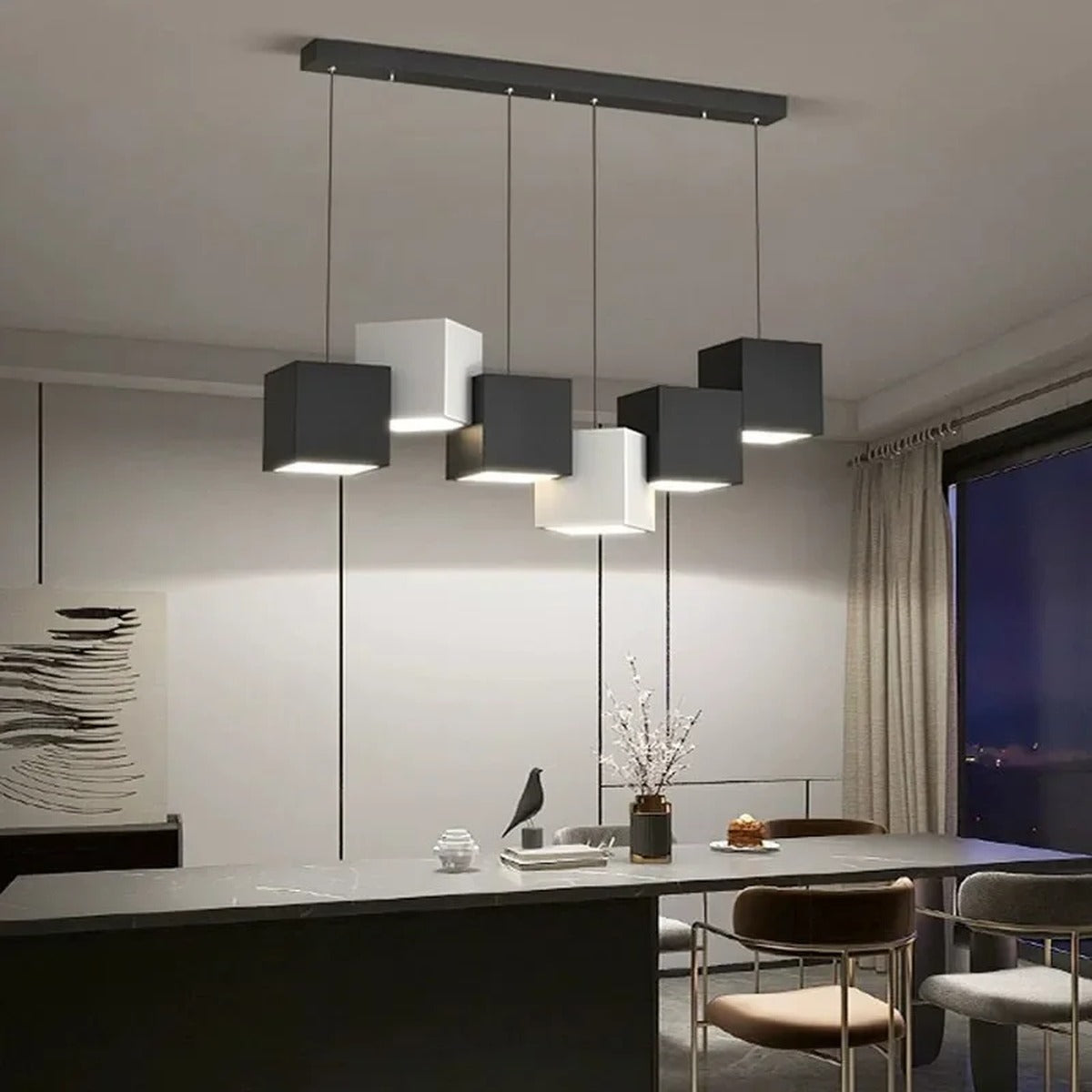 Geometros multi-cube LED pendant bar — 7 cubes mixed black and white, over kitchen island dining area