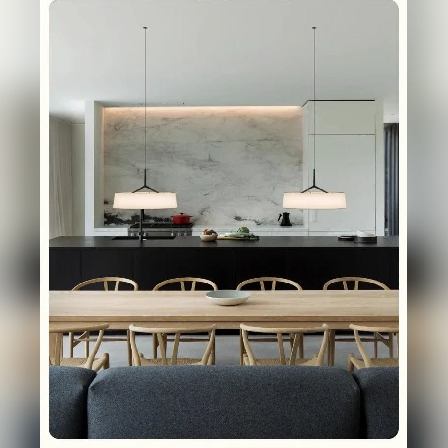 Slender Stem Flat Drum Pendant Light – Walvorn – lifestyle over a marble kitchen island