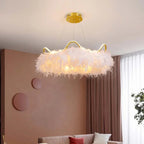 Jevon white feather halo chandelier — warm living room lifestyle view with blush accent wall