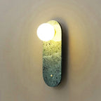 Zarvex travertine oval globe wall sconce — green stone variant, frosted glass globe