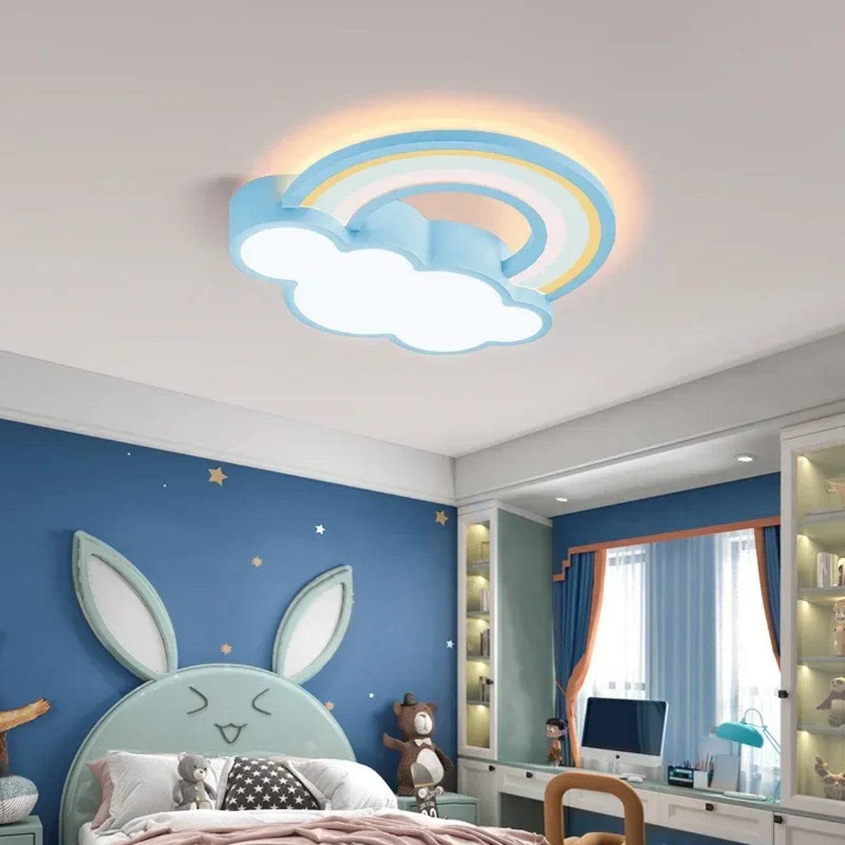 Quieton pastel rainbow and cloud LED ceiling light in a blue child bedroom