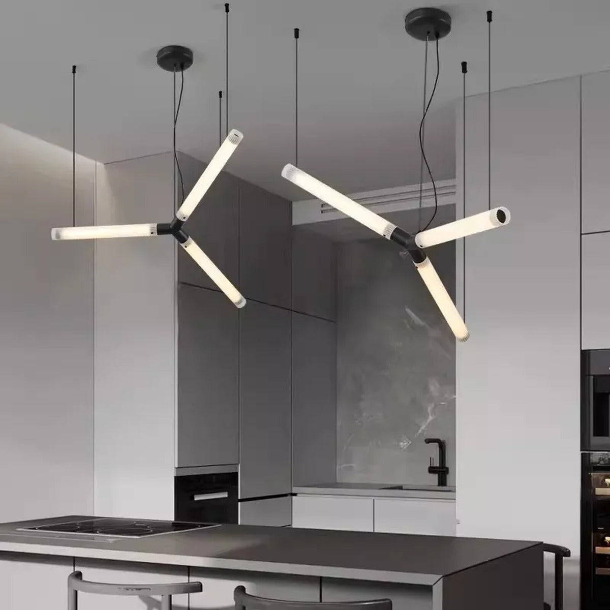 Rarlix multi-arm LED tube chandelier — matte black finish, dual-joint cluster over kitchen island