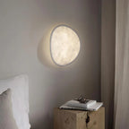 Tenzora organic textured wall sconce lifestyle view, bedroom, warm white light