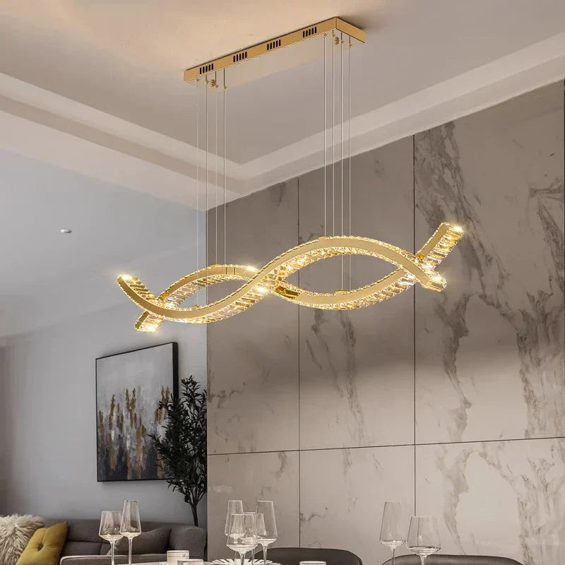 Cerlon crystal linear pendant, 100cm size, above a marble-walled dining room