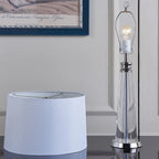 Close-up of the Orindel table lamp's E27 bulb and chrome harp fitting
