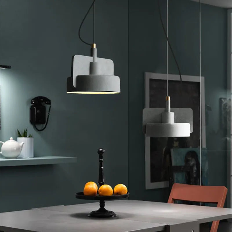 Nordic Industrial Geometric Pendant Light Kvaelindra – Cement Gray pair in a dining nook