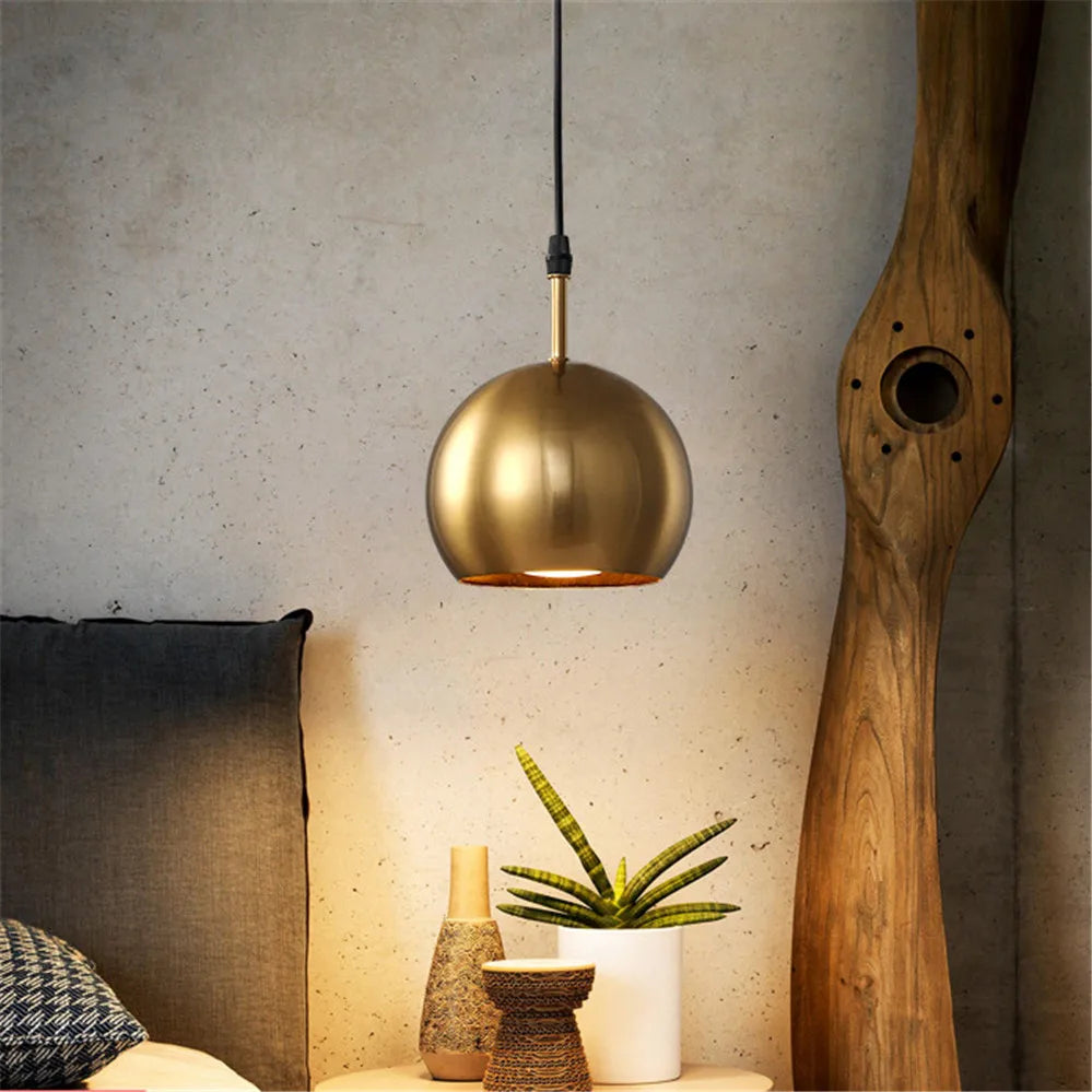 Solindra lamp – underside view showing warm brass interior reflecting downward light