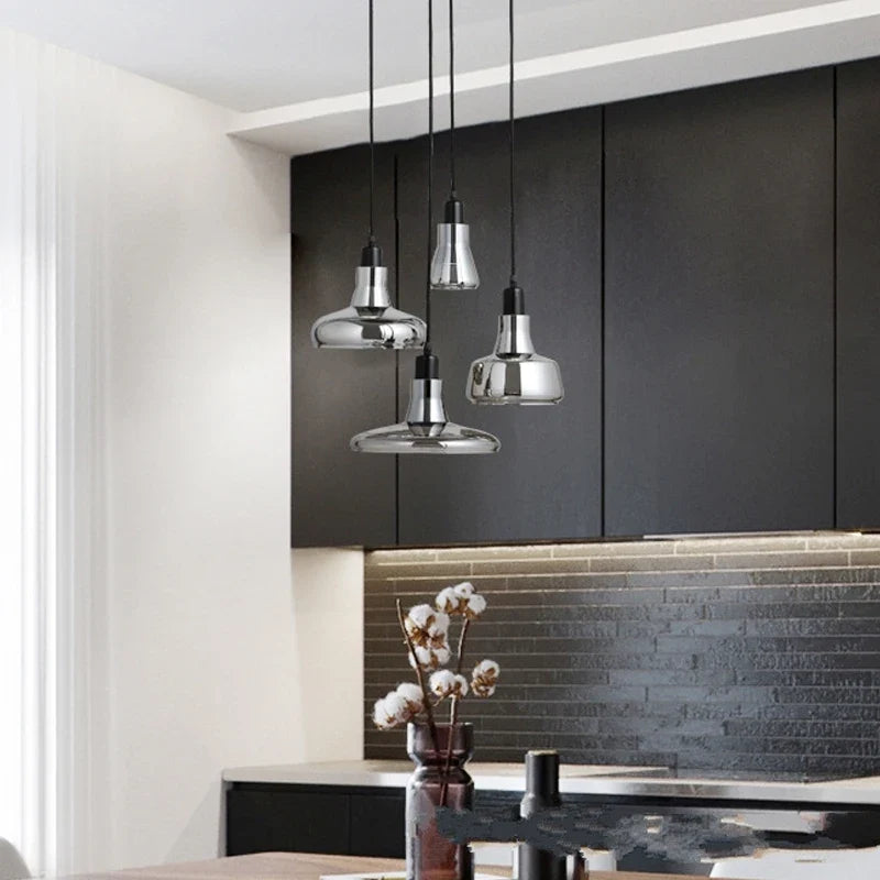 Ozaelix smoked glass pendant – 3 shapes above dark kitchen counter (black cabinets)