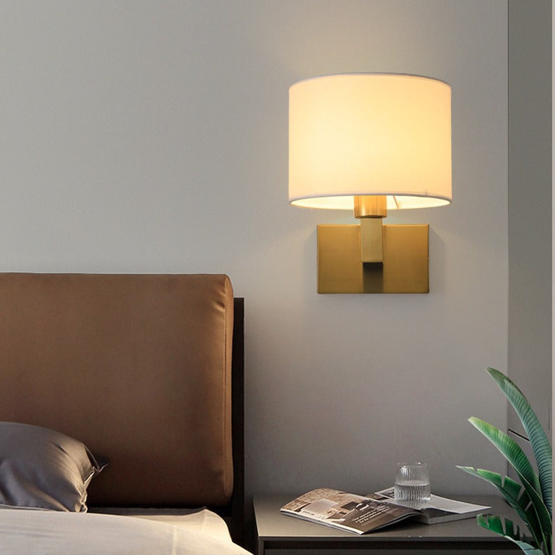 Hermon Fabric LED Wall Sconce – Gold Finish, Bedroom Setting