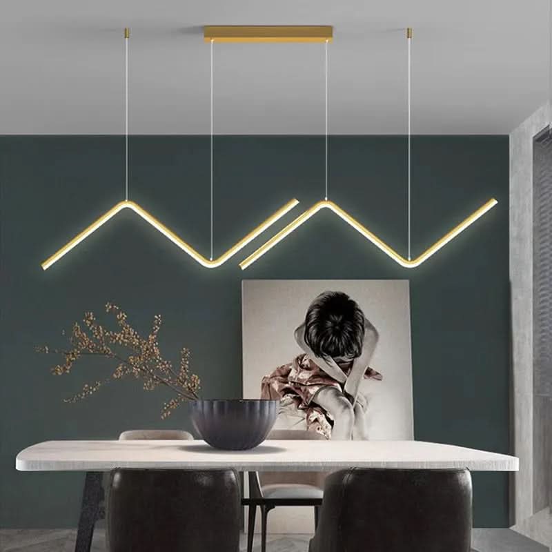 Zendrax angular zigzag LED pendant light in brushed gold in a warm-lit living room