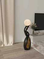 Sculptural Twisted Figure Moon Globe Floor Lamp – Gelrix – Black & Gold Lifestyle