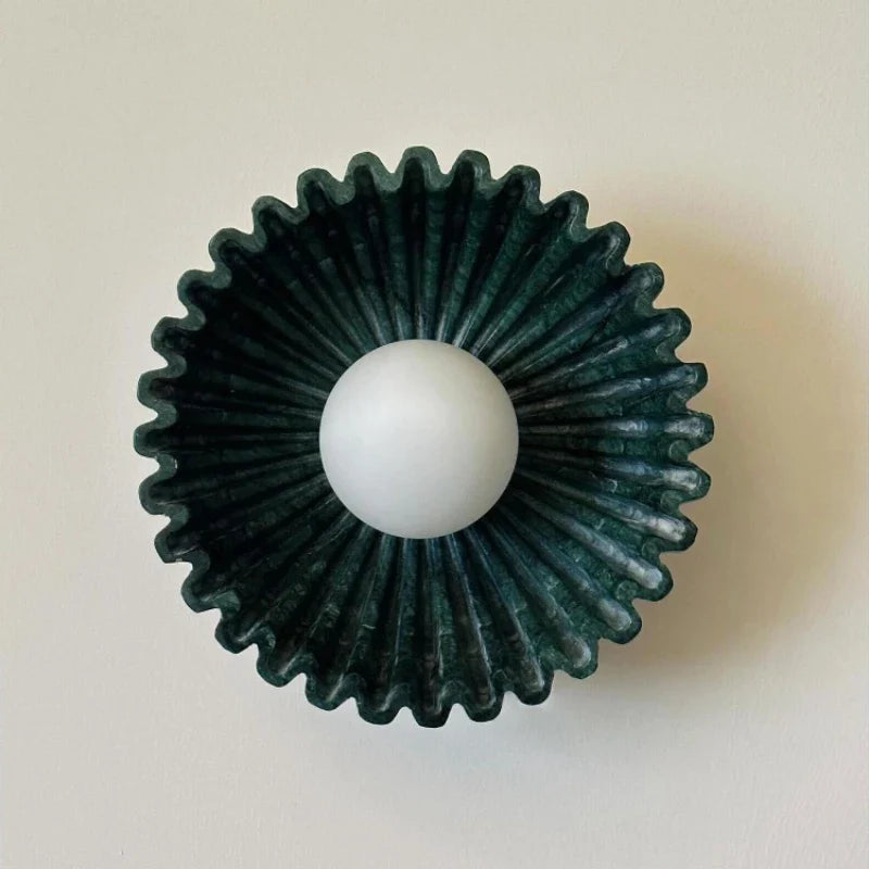 Sunburst Ridged Disc Wall Light – Hevorn – Green marbled ceramic, front view lit