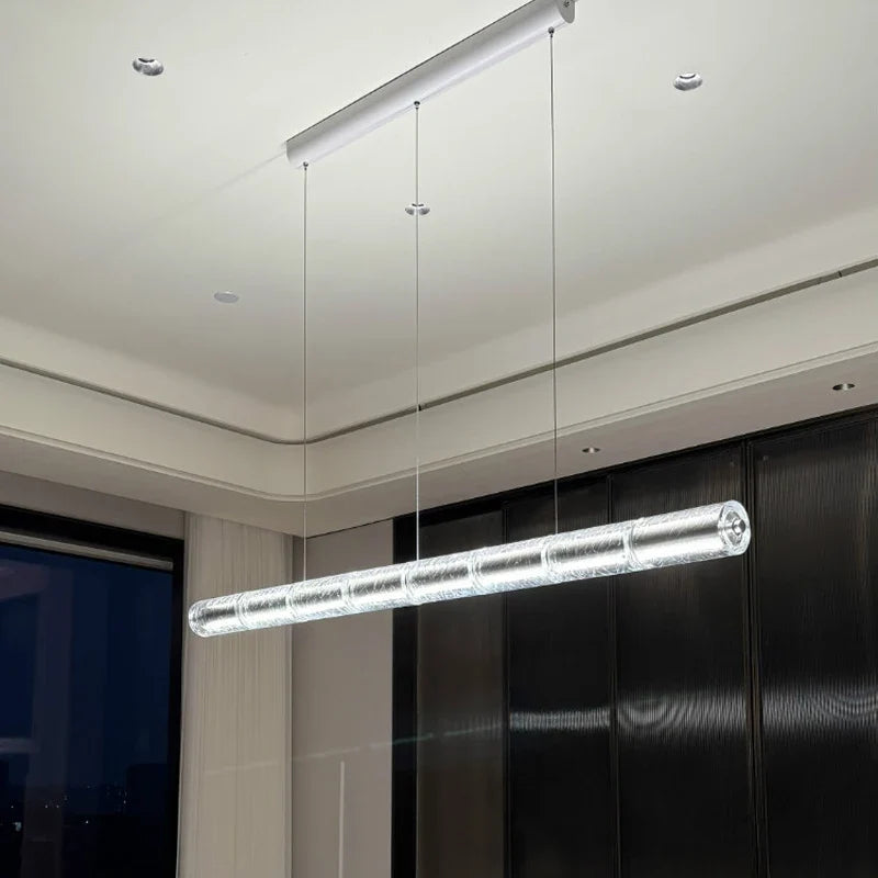 Cristellon crystal tube pendant – full length in modern interior, cool white lit