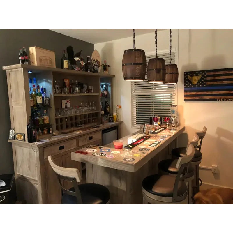 Suaelindra wood barrel pendant lights above a home bar