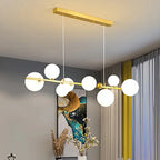 Sculptural Alloy Linear Chandelier Morvelia – Gold Frame, Frosted Opal Glass, Lifestyle
