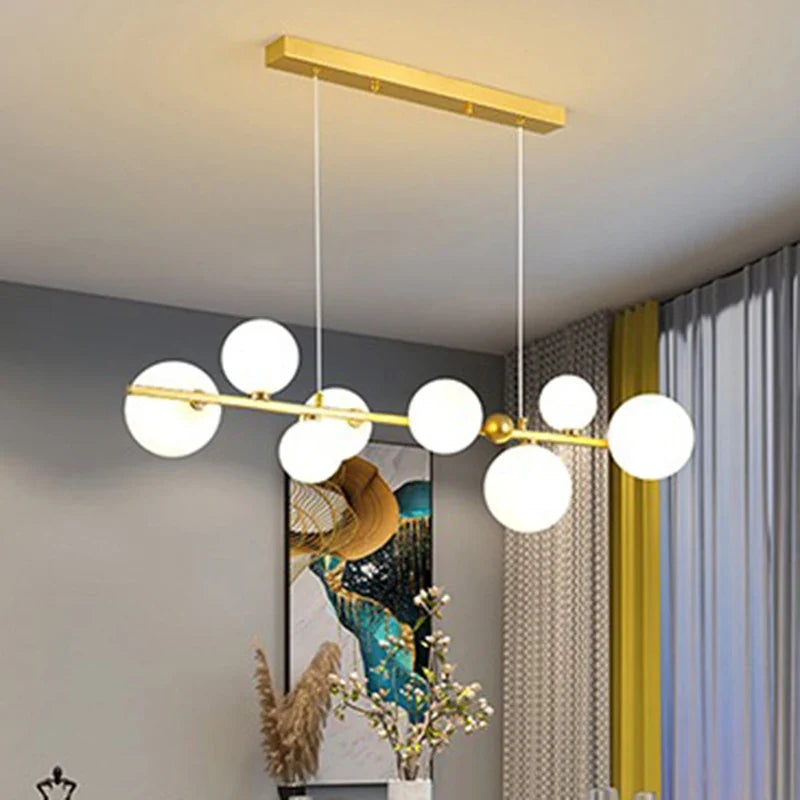 Sculptural Alloy Linear Chandelier Morvelia – Gold Frame, Frosted Opal Glass, Lifestyle