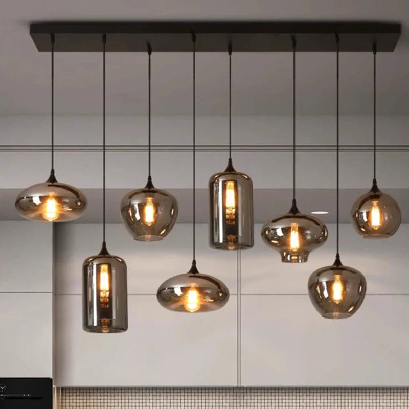 Quintara multi-shape smoked glass pendant system – bar mount with 8 mixed shapes over kitchen