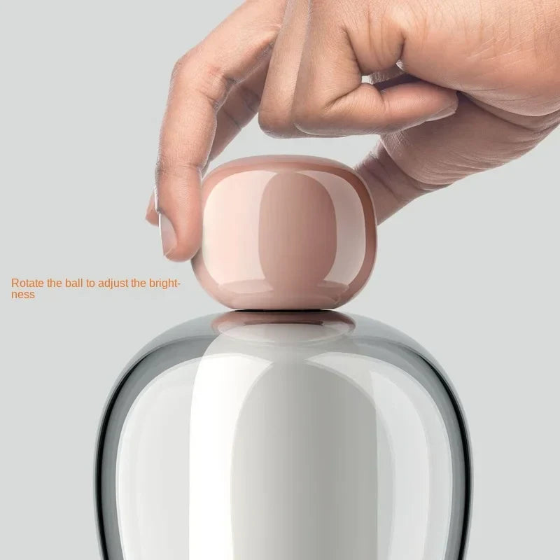 Harovant table lamp dimmer detail, rotate the glass sphere to adjust brightness and colour temperature