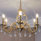 Kaevorn baroque copper and crystal candle chandelier — close-up scrollwork