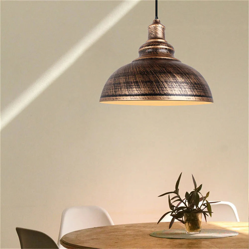 Caldorix Rounded Dome pendant in Bronze finish over a dining table
