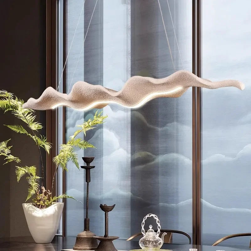 Sculptural wave-form pendant light Velorix wood-tone finish