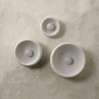 Kalvora plaster wall sconce trio unlit, textured detail