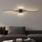 Sculptural Iron Wall Sconce Forlan – Black Finish, Sofa Detail