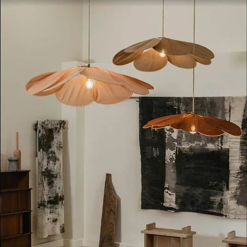 Uzaelvin fabric petal pendants – three different colours in art studio setting
