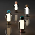 Harovant table lamp, all four finishes together